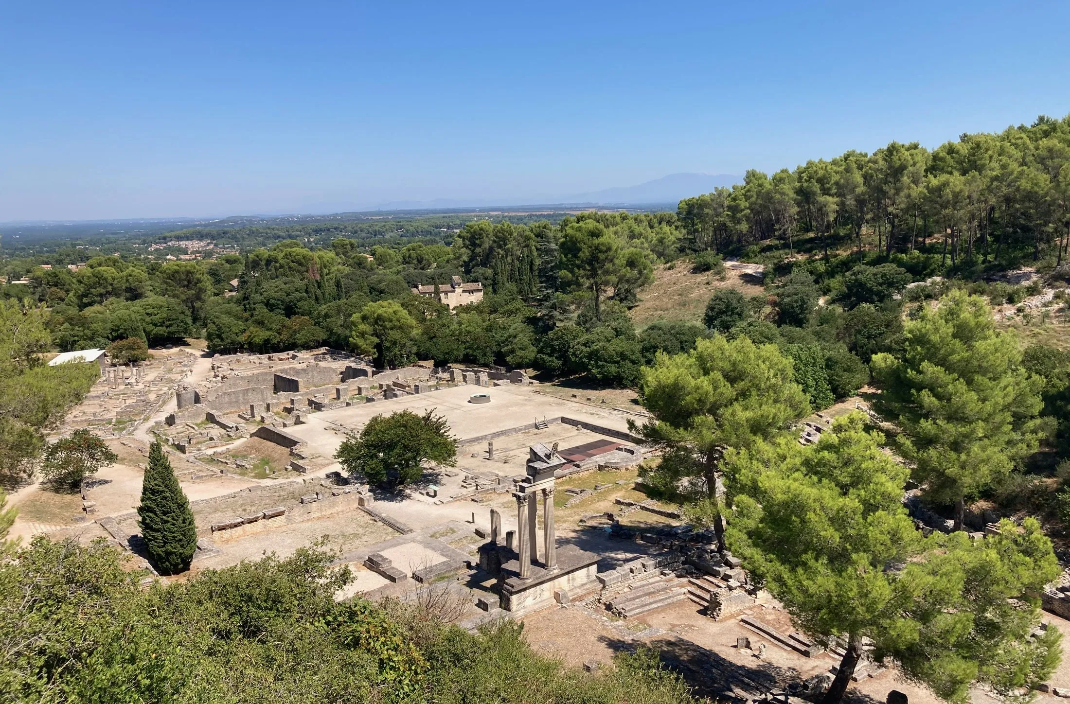The ruins of Glanum seen from above, with the plain of Provence beyond